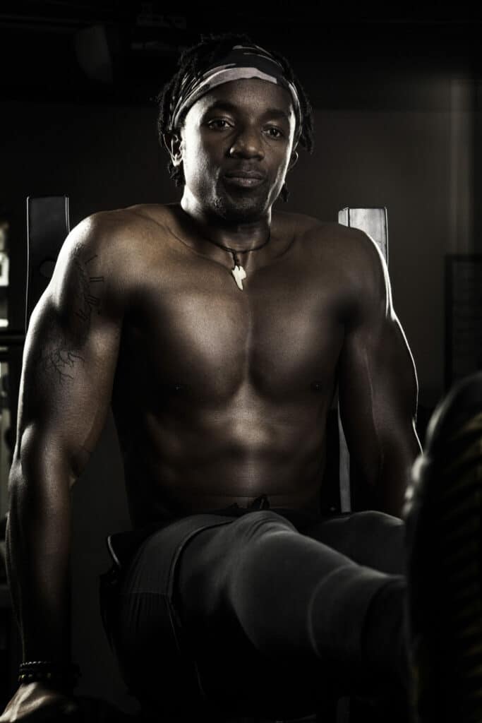 Tendayi, personal trainer in Edmonton, posing in gym